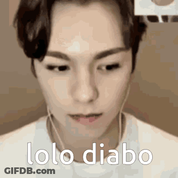 A Close Up Of A Man 'S Face With The Words Lolo Diabo Written On It . GIF