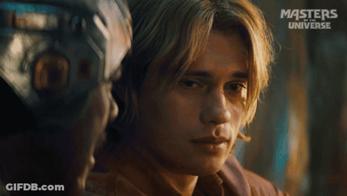 A Close Up Of A Man 'S Face With The Words Masters Of The Universe On The Bottom Right GIF