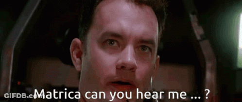 A Close Up Of A Man 'S Face With The Words Matrica Can You Hear Me Written Below Him GIF