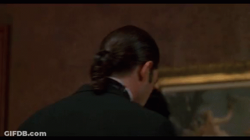 A Close Up Of A Man 'S Face With The Words Misbehave Written On His Face . GIF