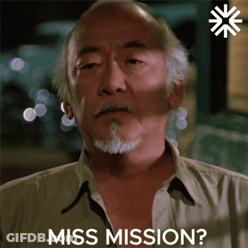 A Close Up Of A Man 'S Face With The Words Miss Mission Behind Him GIF