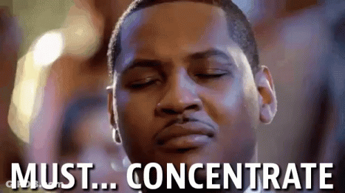 A Close Up Of A Man 'S Face With The Words Must Concentrate Above Him . GIF