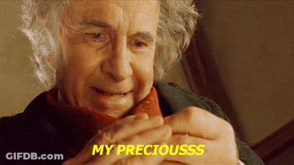 A Close Up Of A Man 'S Face With The Words `` My Preciousss '' Written On The Bottom . GIF