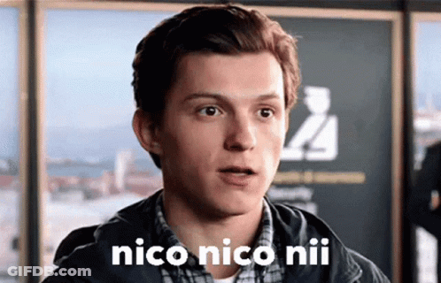 A Close Up Of A Man 'S Face With The Words `` Nico Nico Niu '' On It . GIF