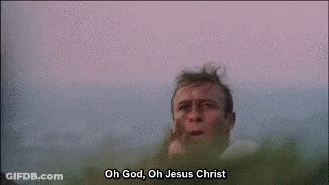 A Close Up Of A Man 'S Face With The Words `` Oh God , Oh Jesus Christ '' Written Above Him . GIF