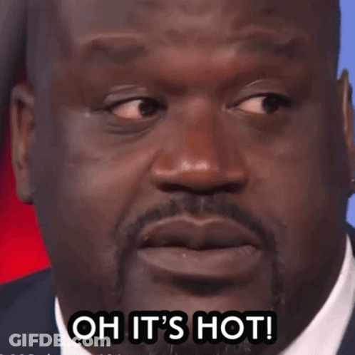 A Close Up Of A Man 'S Face With The Words Oh It 'S Hot GIF