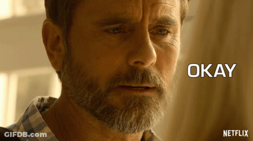 A Close Up Of A Man 'S Face With The Words Okay Written Below Him GIF
