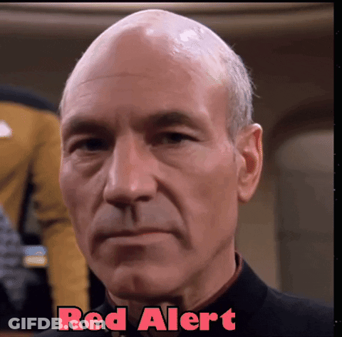 A Close Up Of A Man 'S Face With The Words Red Alert Written Above Him GIF