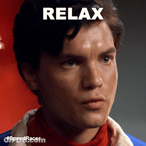 A Close Up Of A Man 'S Face With The Words Relax Written Above Him GIF