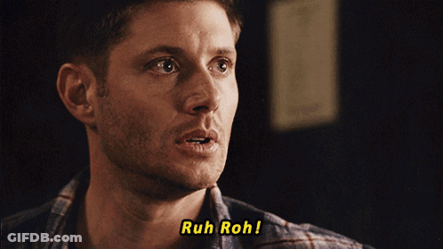 A Close Up Of A Man 'S Face With The Words Ruh Roh Above Him GIF