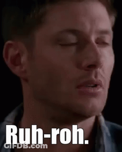 A Close Up Of A Man 'S Face With The Words `` Ruh-Roh '' On It . GIF