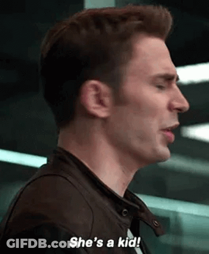 A Close Up Of A Man 'S Face With The Words `` She 'S A Kid '' . GIF