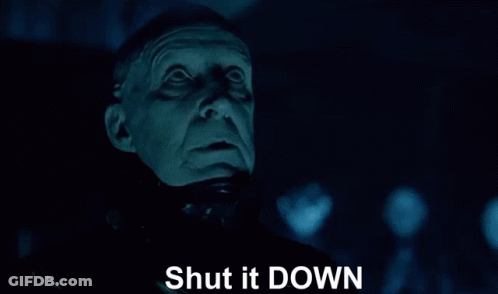 A Close Up Of A Man 'S Face With The Words Shut It Down Written Below It GIF