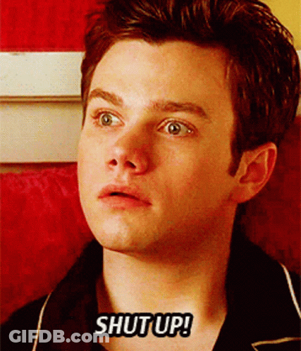 A Close Up Of A Man 'S Face With The Words Shut Up Written On It GIF