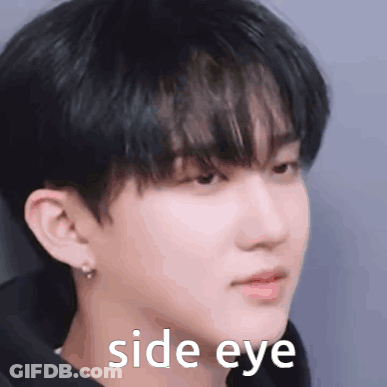 A Close Up Of A Man 'S Face With The Words `` Side Eye '' Written On It . GIF