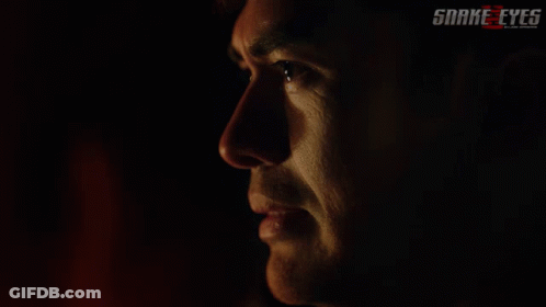 A Close Up Of A Man 'S Face With The Words Snake Eyes On The Bottom Right GIF
