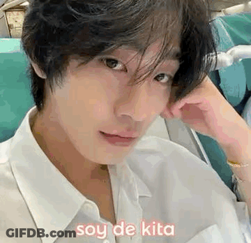 A Close Up Of A Man 'S Face With The Words Soy De Kita Written On It . GIF