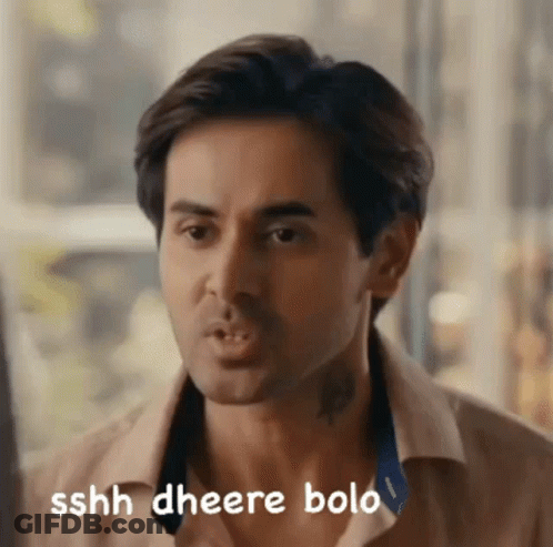 A Close Up Of A Man 'S Face With The Words Sshh Gheere Bolo Written On The Bottom GIF
