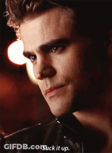 A Close Up Of A Man 'S Face With The Words Suck It Up Below It GIF