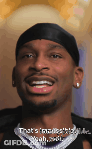 A Close Up Of A Man 'S Face With The Words That 'S Totally Possible Yeah Yeah On The Bottom GIF
