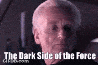 A Close Up Of A Man 'S Face With The Words `` The Dark Side Of The Force '' Written Below Him . GIF