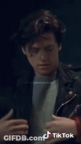 A Close Up Of A Man 'S Face With The Words Tik Tok On The Bottom Left GIF