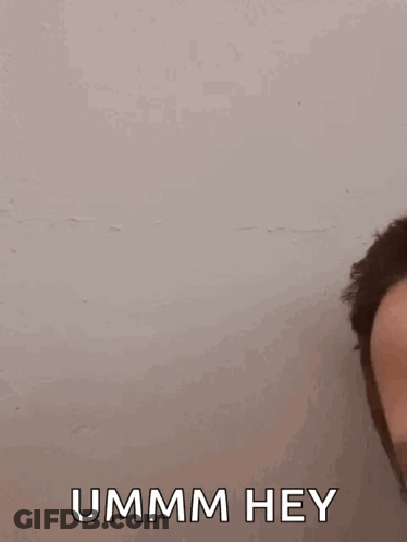 A Close Up Of A Man 'S Face With The Words `` Ummm Hey '' Written On The Bottom . GIF