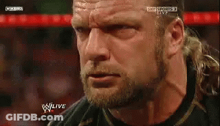 A Close Up Of A Man 'S Face With The Words W Live On The Bottom Right GIF