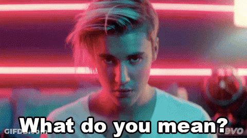 A Close Up Of A Man 'S Face With The Words What Do You Mean . GIF