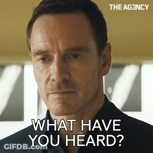 A Close Up Of A Man 'S Face With The Words " What Have You Heard " Above Him GIF