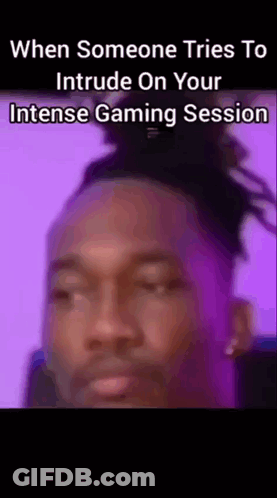 A Close Up Of A Man 'S Face With The Words When Someone Tries To Intrude On Your Intense Gaming Session On The Bottom GIF