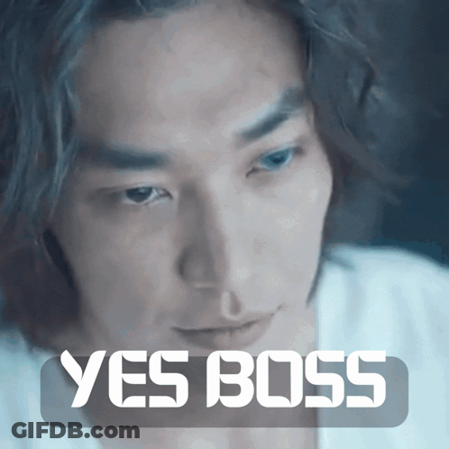 A Close Up Of A Man 'S Face With The Words " Yes Boss " Above Him GIF