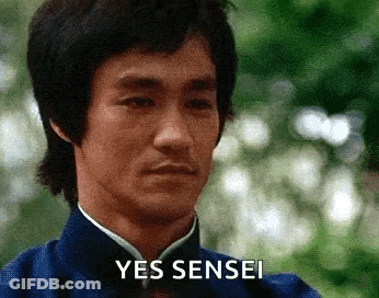 A Close Up Of A Man 'S Face With The Words Yes Sensei Written On It . GIF