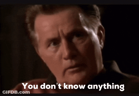 A Close Up Of A Man 'S Face With The Words You Don 'T Know Anything Below It GIF