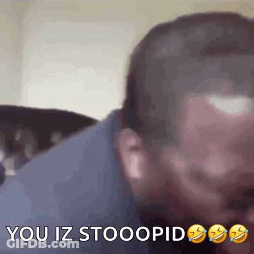 A Close Up Of A Man 'S Face With The Words " You Iz Stooopid " On The Bottom GIF
