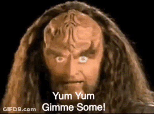 A Close Up Of A Man 'S Face With The Words Yum Yum Gimme Some GIF