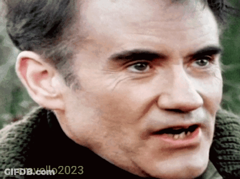 A Close Up Of A Man 'S Face With The Year 2023 On The Bottom Right GIF