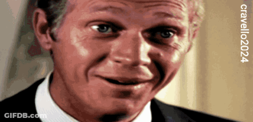 A Close Up Of A Man 'S Face With The Year 2024 GIF