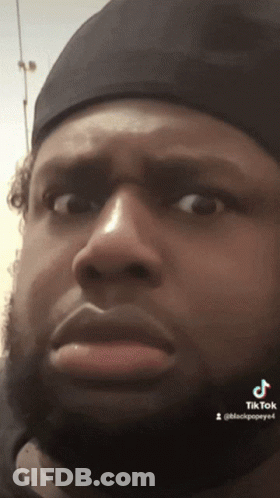 Close Up Of Man's Face With TikTok Text GIF