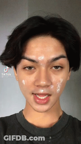 A Close Up Of A Man 'S Face With Tiktok Written On The Bottom Left GIF