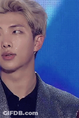 A Close Up Of A Man 'S Face With Water Coming Out Of His Eyes GIF