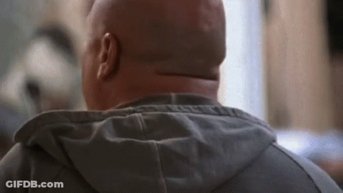 A Close Up Of A Man 'S Head With A Hood On GIF