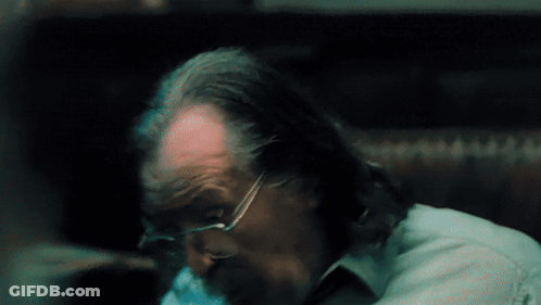 A Close Up Of A Man 'S Head With Glasses And A Beard GIF