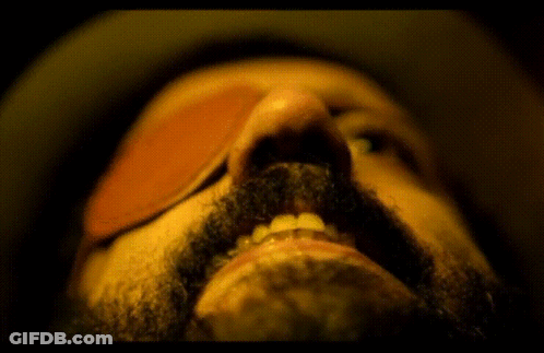 A Close Up Of A Man 'S Mouth With A Beard GIF