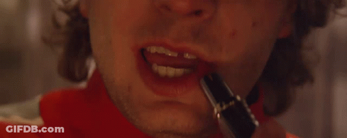 A Close Up Of A Man 'S Mouth With Red Lipstick On It . GIF