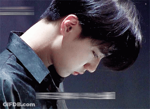 A Close Up Of A Man 'S Neck And Ear With A Glitch Effect . GIF