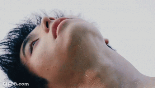 A Close Up Of A Man 'S Neck And Face GIF