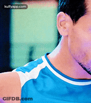 A Close Up Of A Man 'S Neck With The Words Kulfyapp.com Below GIF