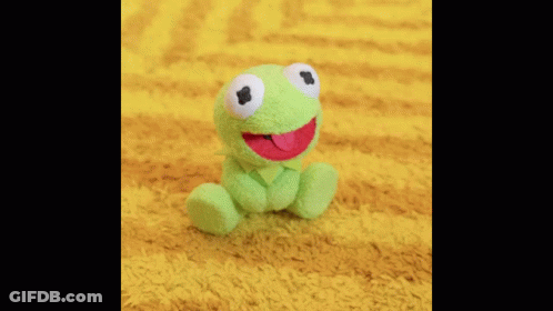 A Close Up Of A Man Singing Into A Microphone . GIF