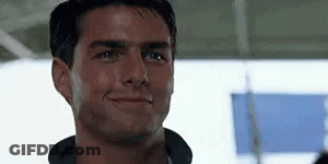A Close Up Of A Man Smiling With His Mouth Open . GIF